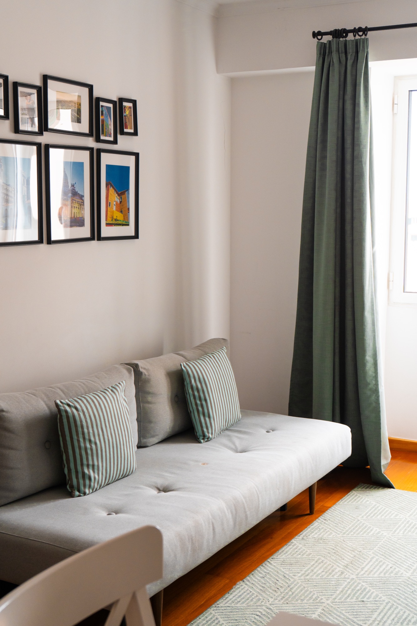 Living room gallery wall with framed travel photography, Madeira, Portugal