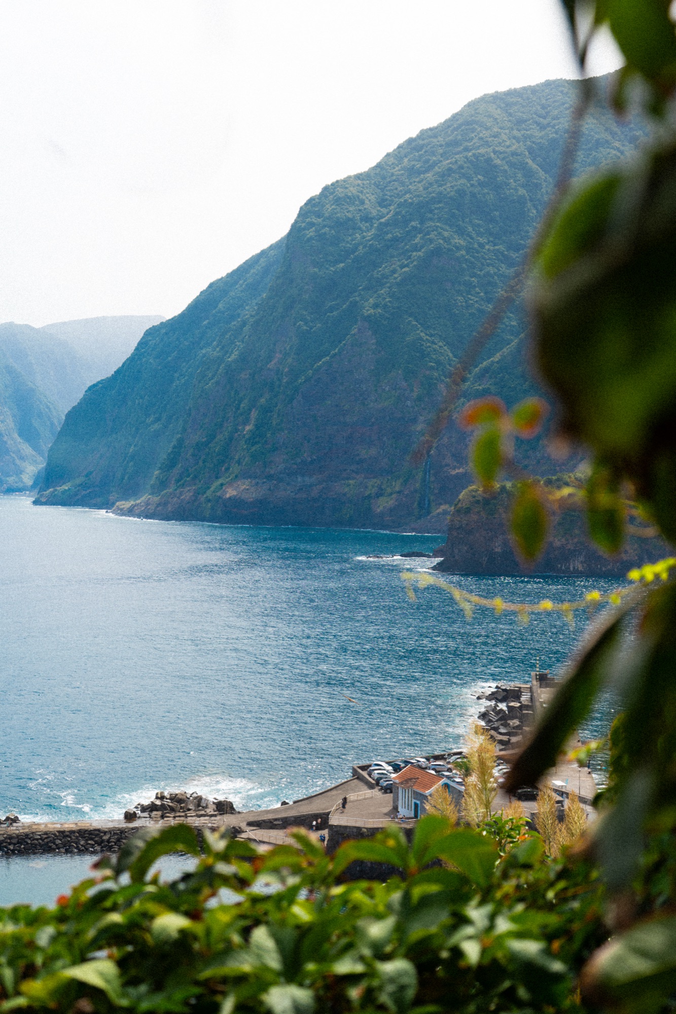 Dramatic coastal cliffs above a seaside village, Madeira, Portugal