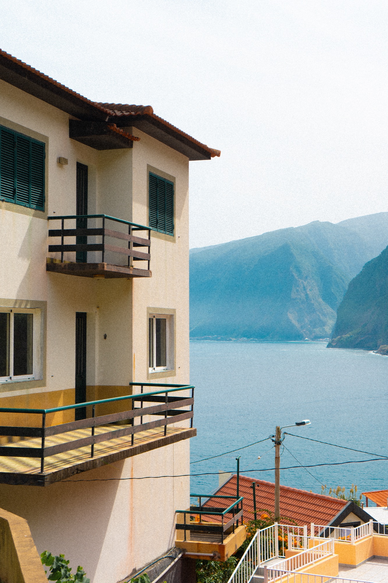 Balcony of a cliffside apartment overlooking the ocean, Madeira, Portugal