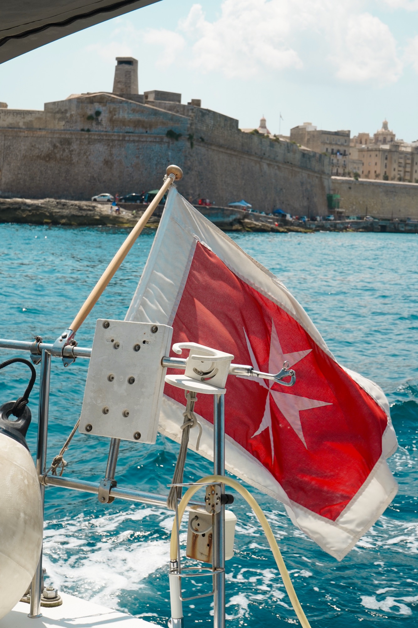 Maltese cross flag aboard the sailing charter, Valletta, Malta
